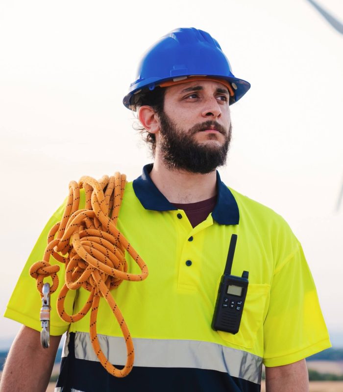 vertical-bearded-technician-engineer-of-windmill-and-renewable-energy-industry-working-and-looking.jpg